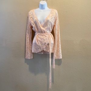Sheer lace Victoria Secret wrap around long sleeve top with a slight bell sleave